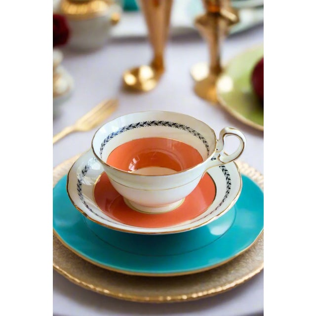 AYNSLEY BONE CHINA TEACUP AND SAUCER Era: Mid-20th Century (1940s-1960s) Origin: England OVERVIEW: An elegant Aynsley fine...