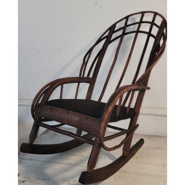 This fine hand made rustic bentwood rocking chair has a suede seat cushion and is in fine condition.It is a very sturdy...