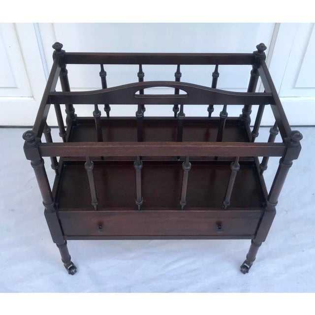 Here is a beautiful magazine rack, known as a canterbury rack, made by Ferguson in New York, in the early 20th century...