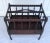 Here is a beautiful magazine rack, known as a canterbury rack, made by Ferguson in New York, in the early 20th century...