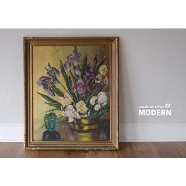 Gorgeous vintage oil on canvas by Gladys T Smith featuring a still life of flowers and a buddha head sculpture. With its...
