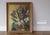 Gorgeous vintage oil on canvas by Gladys T Smith featuring a still life of flowers and a buddha head sculpture. With its...