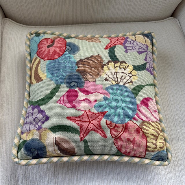 Wonderfully charming vintage needlepoint pillow featuring a colorful collection of seashells and starfish. Beautifully...