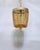 Infuse your space with warmth, character, and a touch of vintage glamour with this captivating amber glass beaded...