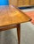 Pair of Mid Century Modern Danish teak side tables by Grete Jalk of Denmark. The tables are crafted from solid teak and...