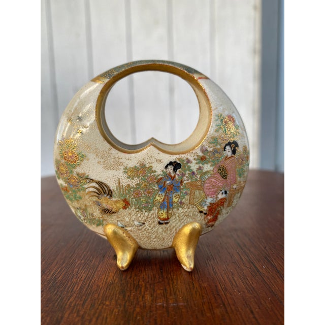 A beautiful and intricately hand-painted satsuma moon vase from the Fujisan studio of the Meiji period, circa 1900. Each...