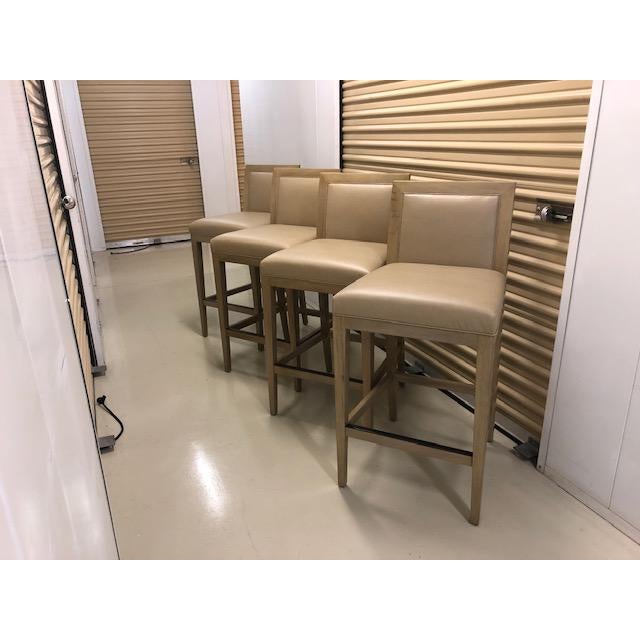 Custom Counter Stools, made from Walnut and stained in a Modern Sand finish. Seat and Back upholstered in HBF Textiles...