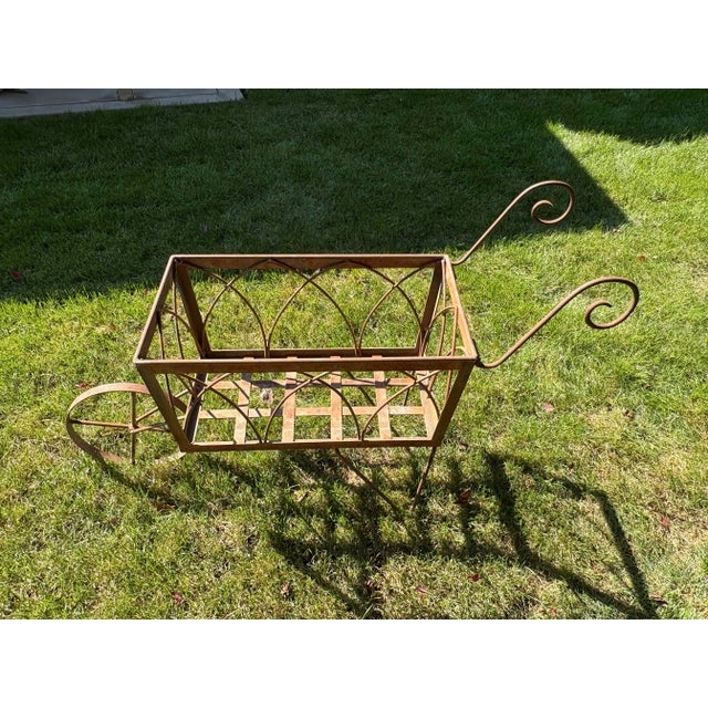 This wheelbarrow is made of sturdy steel and has been used in my personal outdoor garden space for many years. It is dated...