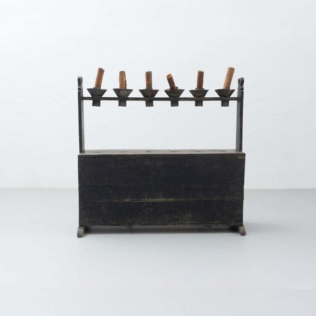 This antique Hachero candleholder is a traditional piece from Spain, crafted from stained wood and dating back to circa...