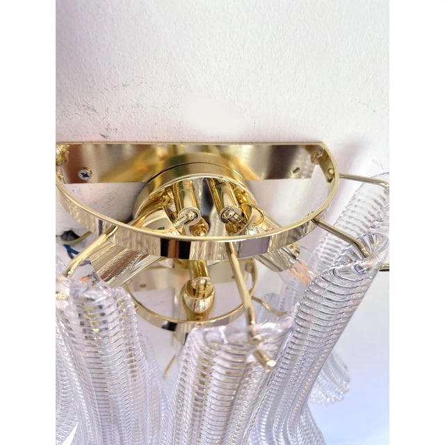 Luxury and and elegant diamanted transparent “selle” wall sconce “selle” elements in murano glass poured over a mold from...