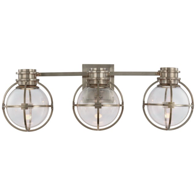 Gracie Triple Sconce in Antique Nickel with Clear Glass Designer: Chapman & Myers Height: 8.75" Extension: 8.25"...