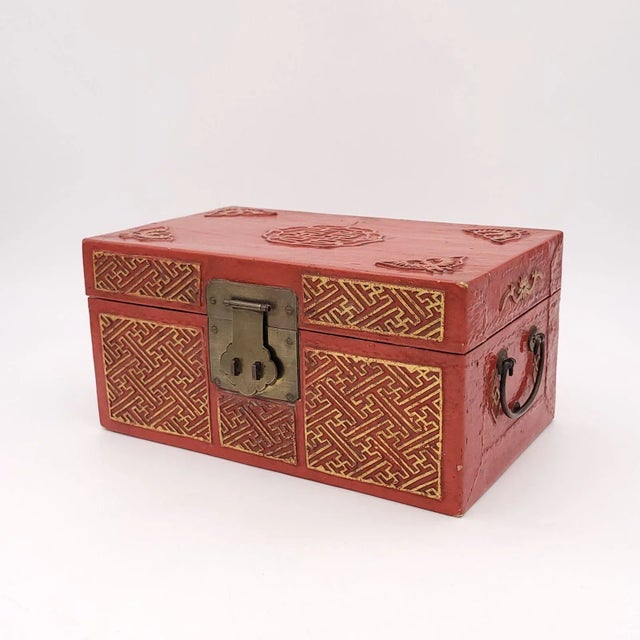 A Chinese red lacquered and gilt pig skin jewelry box, circa 1900.