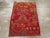 This early 20th century Turkish Anatolian Wagireh rug, measuring 2' 6" x 3' 9", is a vibrant sampler piece traditionally...