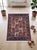 This hand-knotted wool rug reinterprets the classic Persian Bakhtiari garden design, its rust field divided into a grid of...