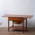 A teak sewing table designed by Hans J. Wegner for Andreas Tuck, model AT-33, produced in Denmark in the 1960s. Two drop-...
