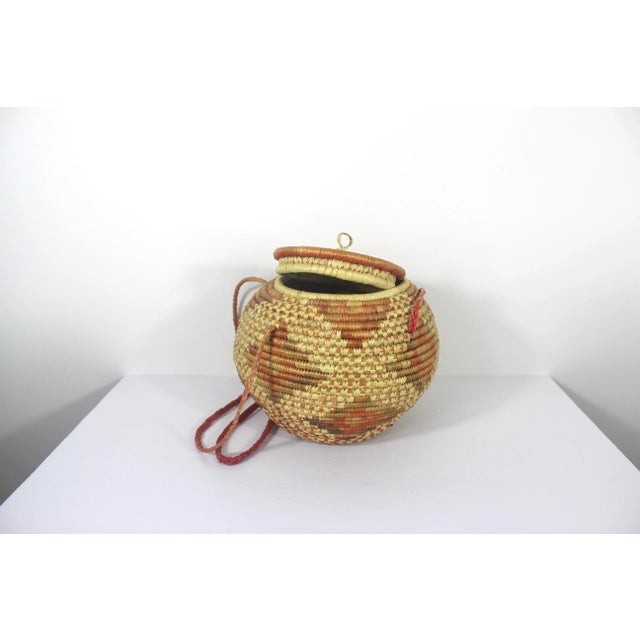 Vintage African Coiled Straw Lidded Two Tone Orange Hand Woven Covered Basket With Straps For Sale - Image 4 of 10