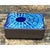 This trinket box makes its strongest statement through its enameled lid, where a radiating, sunburst-like pattern of...