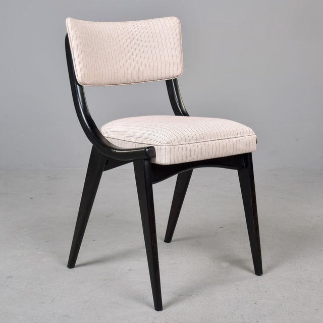 Found in England, this set of 12 dining chairs date from approximately 1950. Frames have painted black satin finish and...