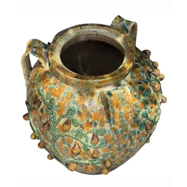 This striking vintage Italian Majolica terracotta planter urn brings an authentic touch of Mediterranean charm and rustic...