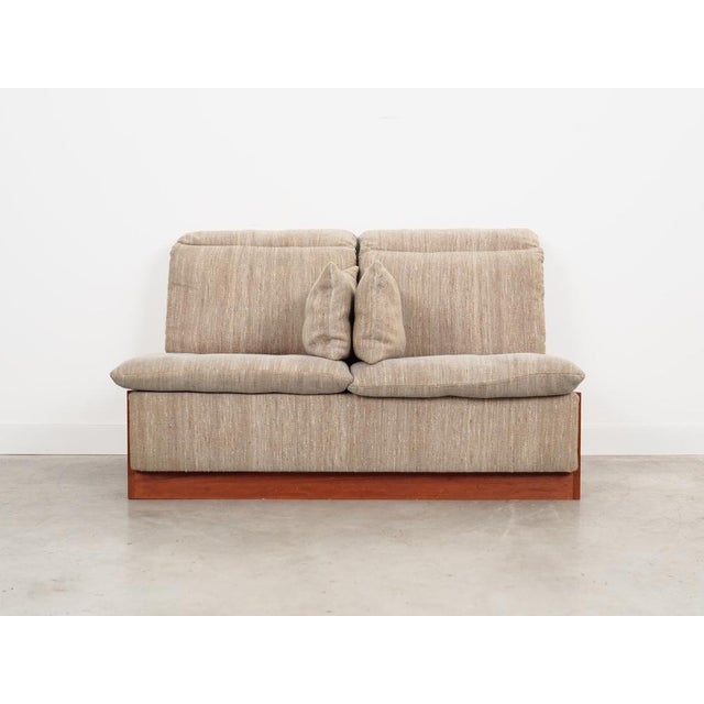 The sofa was made in the 1970s, Danish production. The structure of the furniture is made of teak wood. Wood after...