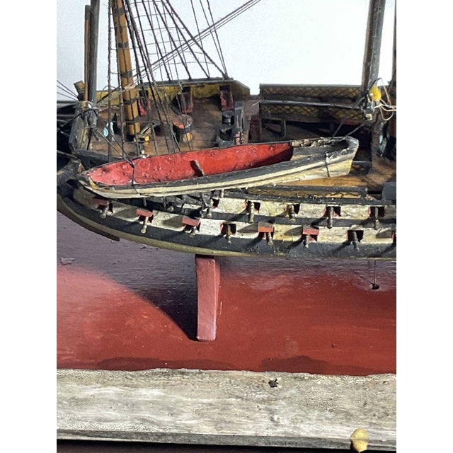 Antique ship model of an English Ship of the line. Three deck warship with cannon, longboats, belfry, figurehead, flags,...