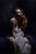 In The Room Where You Sleep by Daire Lynch | Acrylic, gold leaf oil on canvas of a woman seated in shadow. For Sale