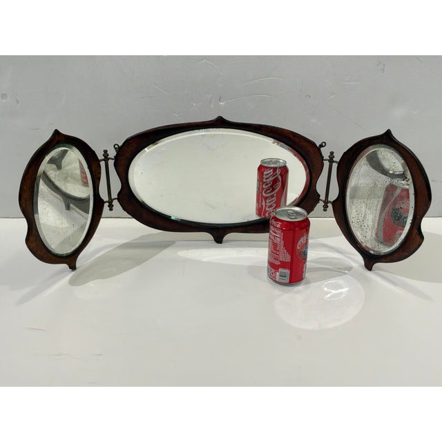 Stylish Antique English Gentlemen's Shaving Mirror. 3 mirrors with antique look, brown wood. Can stand on its on, also has...