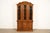An exceptional French Regency Louis XVI style lighted breakfront bookcase cabinet By Drexel USA, Circa 1960s Walnut, with...