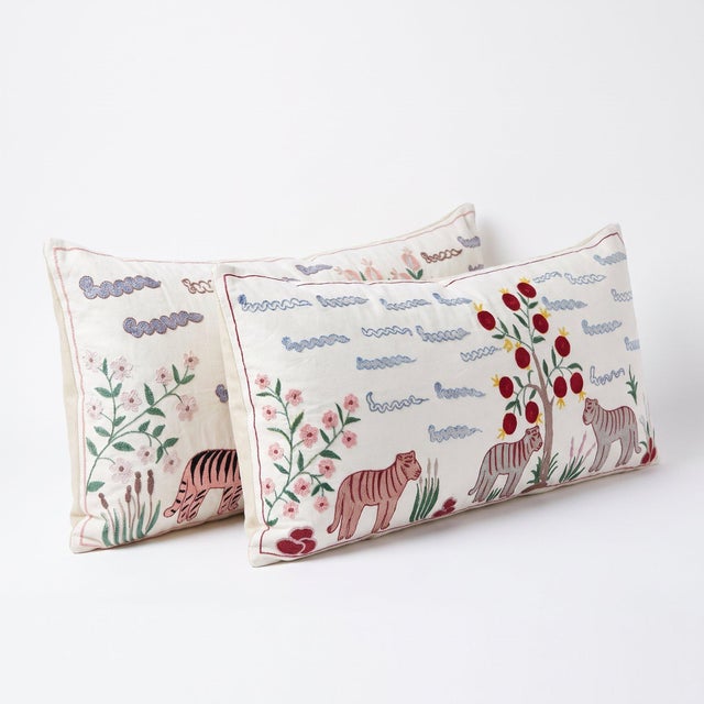 An extra-long lumbar pillow cover set made from hand-embroidered Uzbek Suzani cotton — hand embroidered tigers and...