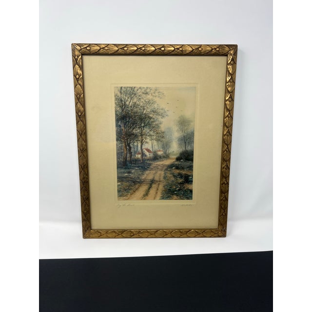 An antique color lithograph titled “By the Road,” bearing a copyright date of 1900 and signed in pencil by the artist at...