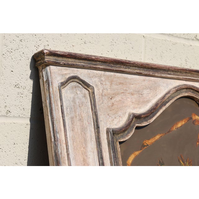 Beautiful French trumeau mirror from the 1950s featuring an elegant hand-painted upper panel decorated with a charming...