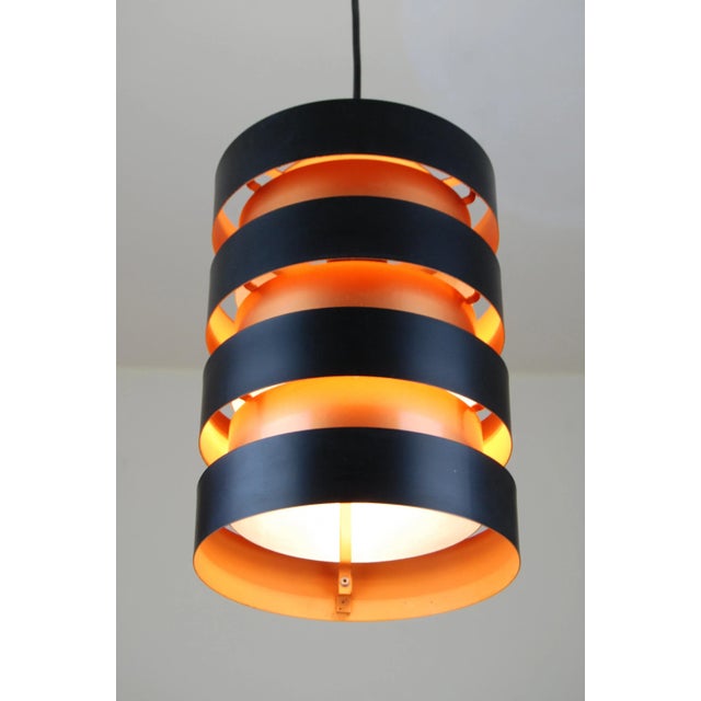 Eiffel pendant light designed by Jo Hammerborg in 1963 for Fog & Morup, Denmark. The light consists of a total of seven...