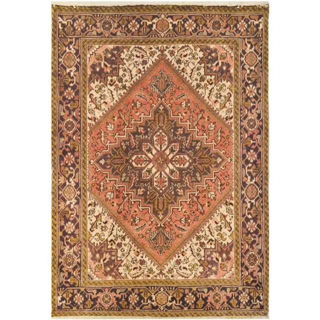 Authentic handwoven Heriz from northwest Iran. This highly sought-after rug is made of fine natural Persian wool and it...