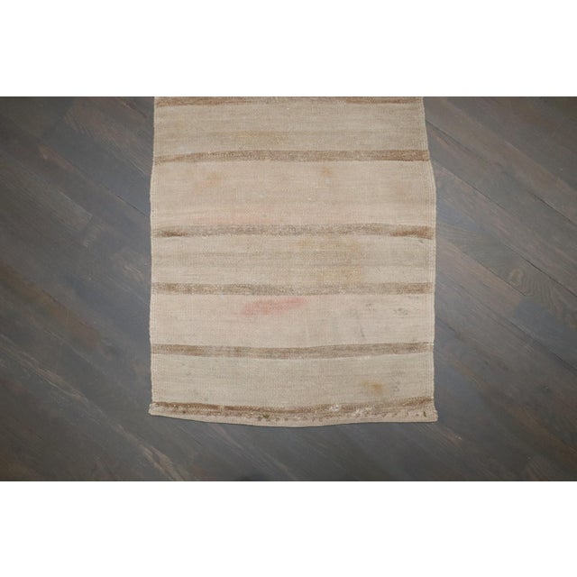 A mid-20th-century discolored small kilim