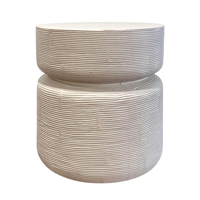 Beautiful cream ivory finish round cement side table. Round table with hand-etched grooves around side which creates for...