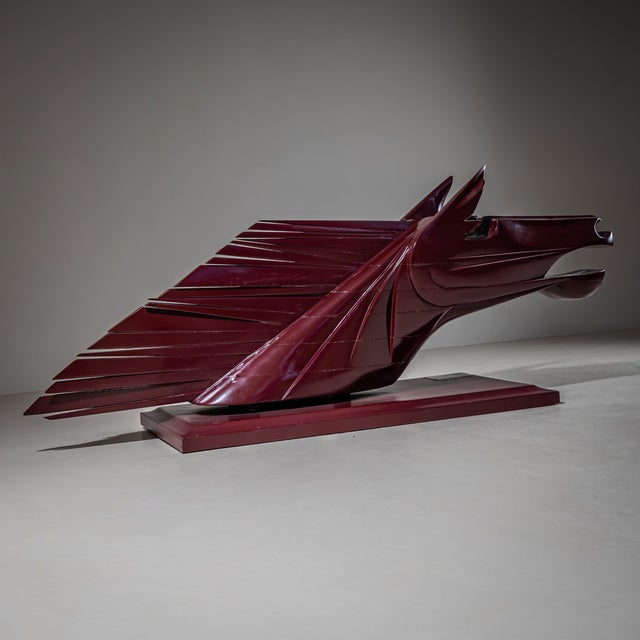 Futuristically styled, dynamic sculpture of a horse’s head. Material: dark red lacquered wood. Weight: 35 kg. Elvio...