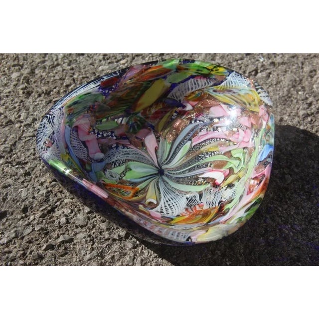 This multicolor Murano glass bowl is reminiscent of Toso Martens. The colors are very particular and rare. I have official...