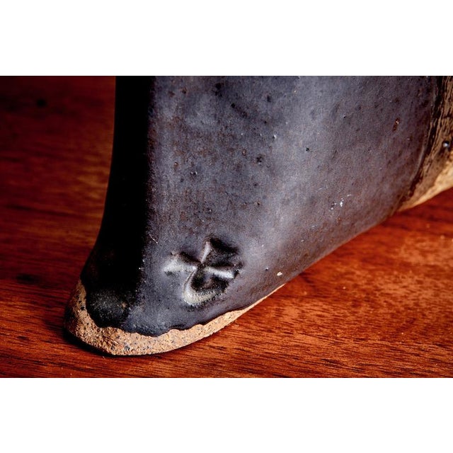 Hand-built ceramic vase with a sculptural, asymmetrical form and an irregular torn rim, made by The Terry Pottery in...