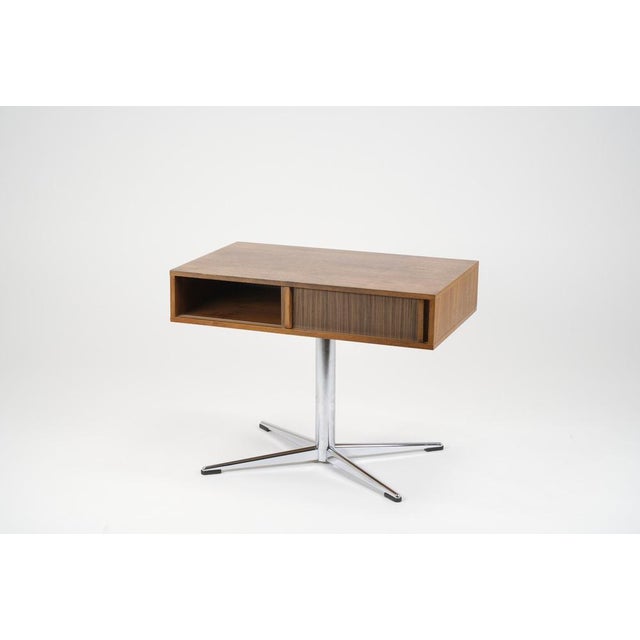 Classic TV table from the 1970s in Germany. The body made of real wood veneer (probably walnut) rotates on a chrome frame...