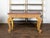 An English giltwood console table from the early 19th century with mahogany veneered top, brass banding, Vitruvian scroll...