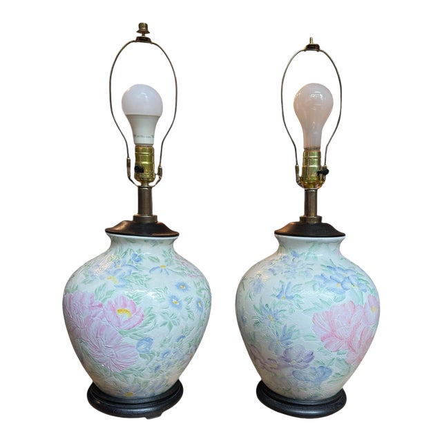Offering a vintage Chinosserie ceramic hand-painted floral table lamp. Ceramic ginger jar with a black wood base and...