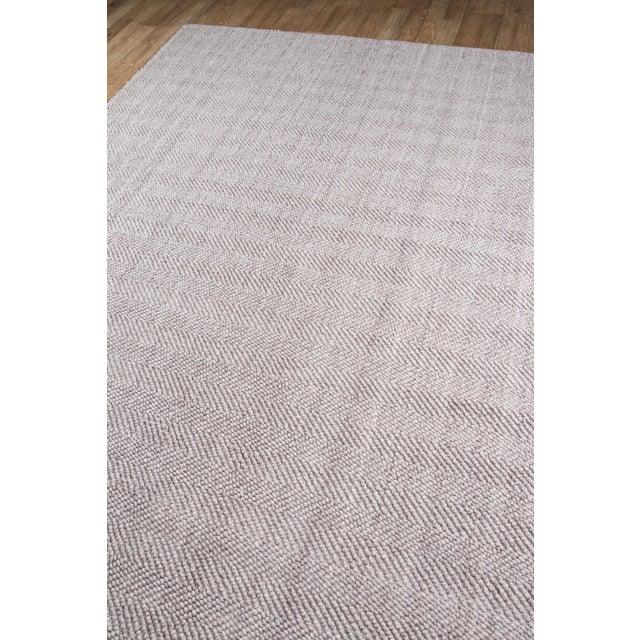 Simple and chic, this decorative area rug collection offers a fashionable foundation for modern floors. Available in gray,...