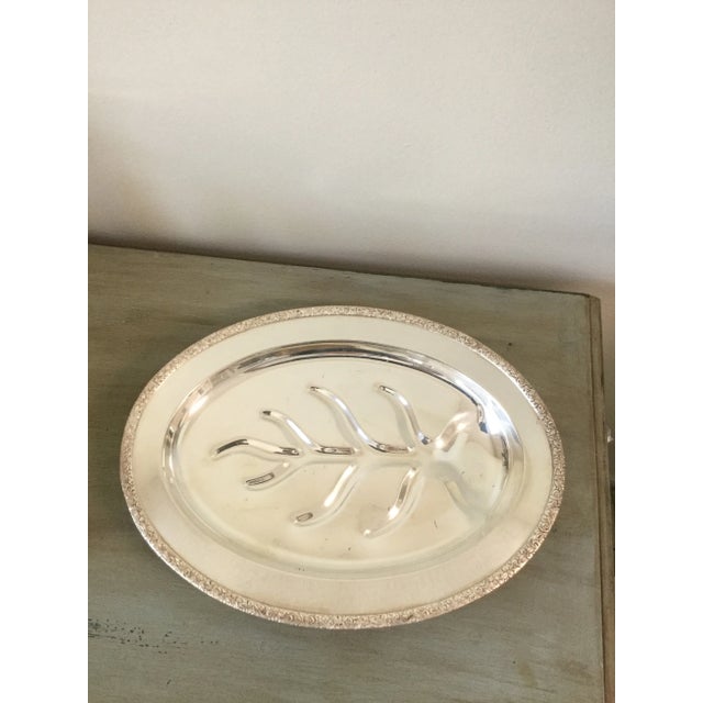 Beautiful vintage Trent silver-on-copper serving platter featuring four elegant ball feet and a classic oval silhouette....