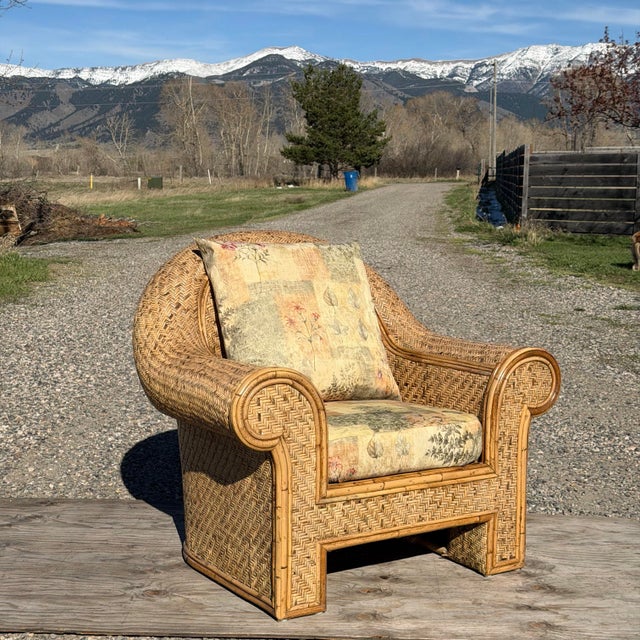 Gorgeous oversized organic modern fan back lounge chair featuring woven rattan wicker, designed in the 20th century for...