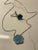 Turquoise famous shape pendant set surrounded by cz's with silver chain 1' wide 16" long