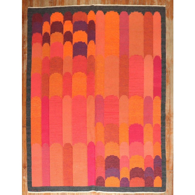 This dramatic vintage rollaken kilm rug was woven in Kronoborgs Lans Hemslojd-Kristianstad by Irma Kronlund in 1955...