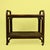 A rattan and cane bar cart, the woven cane shelves and rattan frame bringing island texture to cocktail hour. At twenty-...