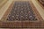 An authentic vintage traditional Varamin rug hand-knotted with fine wool and natural dyes. This intricately woven rug...
