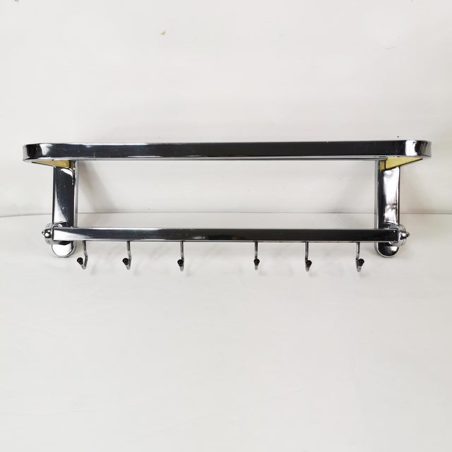 This wall-mounted coat rack, originally from Czechoslovakia in the 1950s, is characterized by solid craftsmanship and...