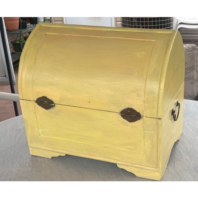 This decorative storage box reflects the popularity of tropical and safari-themed furniture that gained prominence in...
